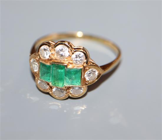 A gold, diamond and three stone emerald cluster ring, size Q.
